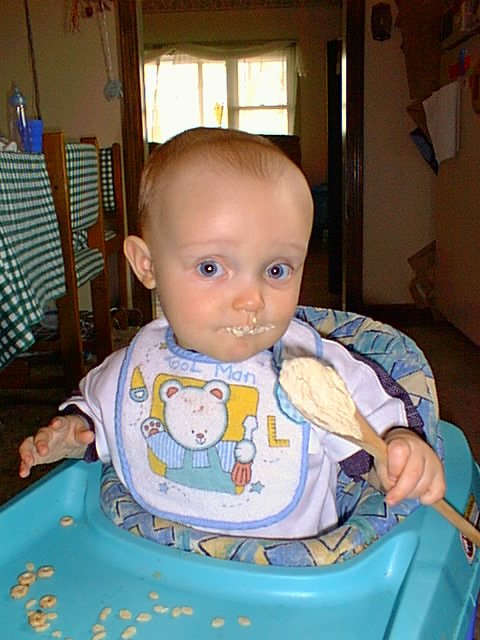 Elijah helped mommy with the dishes by eating the cookie dough off the spoon.