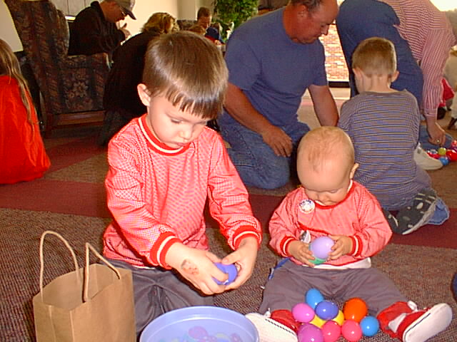 Timothy and Elijah had fun taking all the candy out of the Easter eggs.