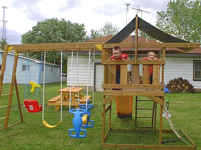 Timmy and Eli looking out the back of their fort.
