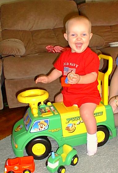 Elijah on his new wheels from Uncle Lynn, Auntie Rhonda, Aaron & Sarah.