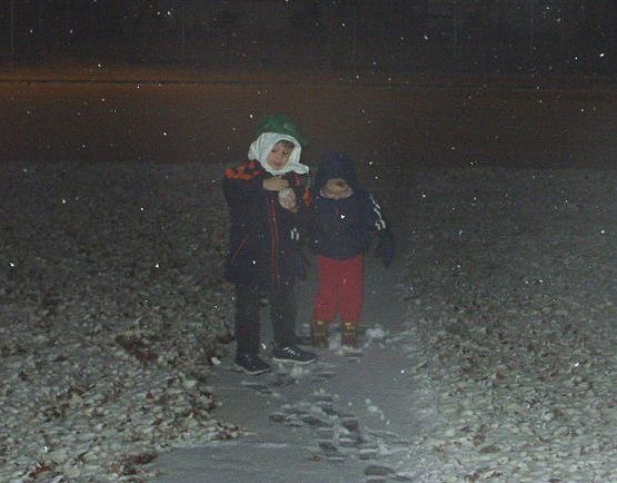 Timothy made the first big snowball...and then he hit Elijah with it :) hehe