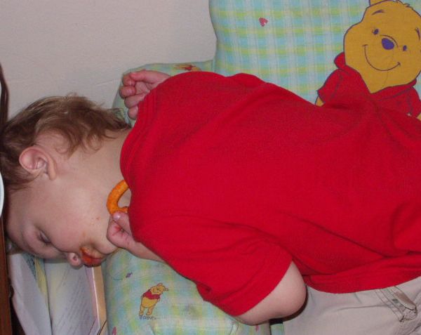 Elijah fell asleep while eating cheese curls!