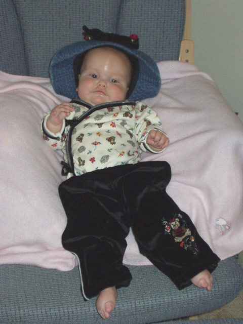 Mary is riding her 'bike' with one hand :)