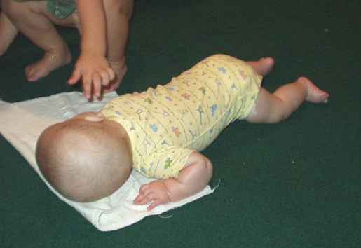 Mary is trying to crawl. You have to look close :)