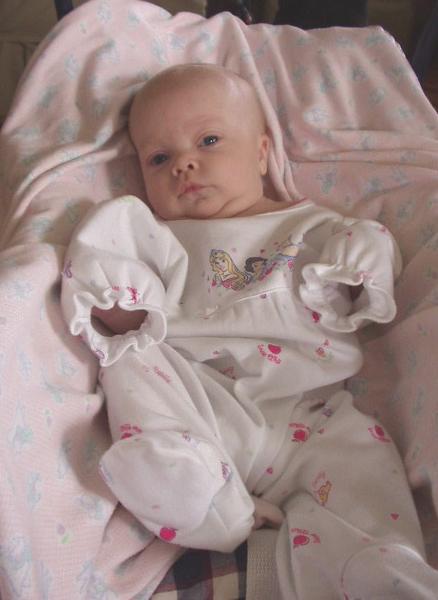 She still doesn't fit into 0-3 month clothes very well :)