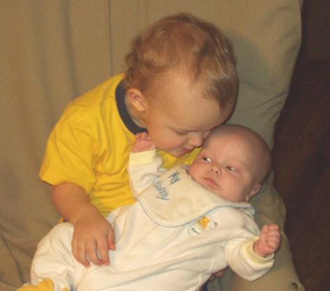 Elijah loves to kiss on Mary. (I don't think she is so sure about it!)