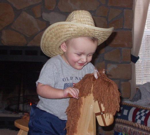 Elijah is an instant cowboy with his hat!