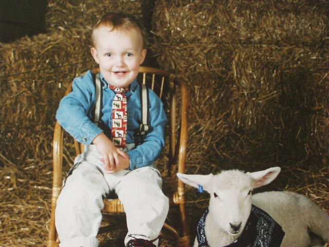 Elijah had his picture taken with a lamb for Easter :)