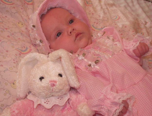 Mary in her little pink dress that Great Grandma made. (Also pictured is Mary's bunny from Mamaw)