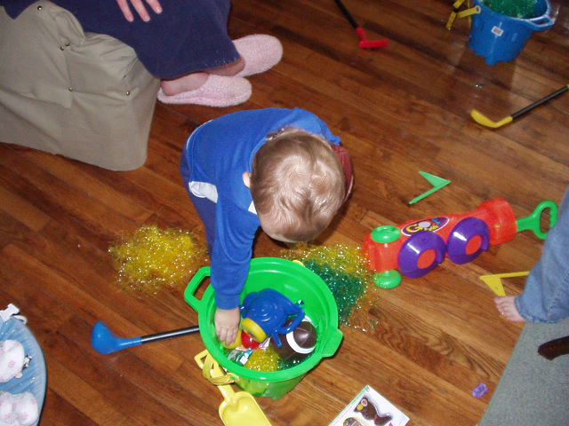 Elijah was still picking through his Easter bucket. Timothy liked Elijah's golf set and Elijah liked Timothy's football. (Isn't that how it always works out!)