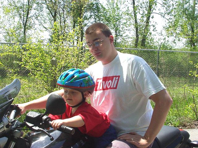 Daddy & Elijah on the motorcycle. They take turns steering :)
