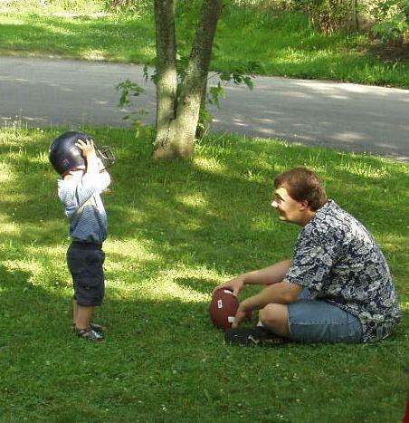 This is how you put the helmet on Daddy...