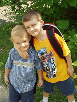 Timothy and Elijah share a moment before Timothy goes to school.