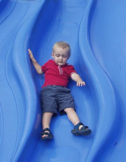 Elijah wasn't really sure about going down the slide.