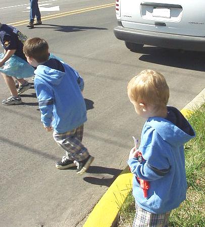 Timothy is running to get candy. (Elijah is waiting on Tim to bring some candy back.)