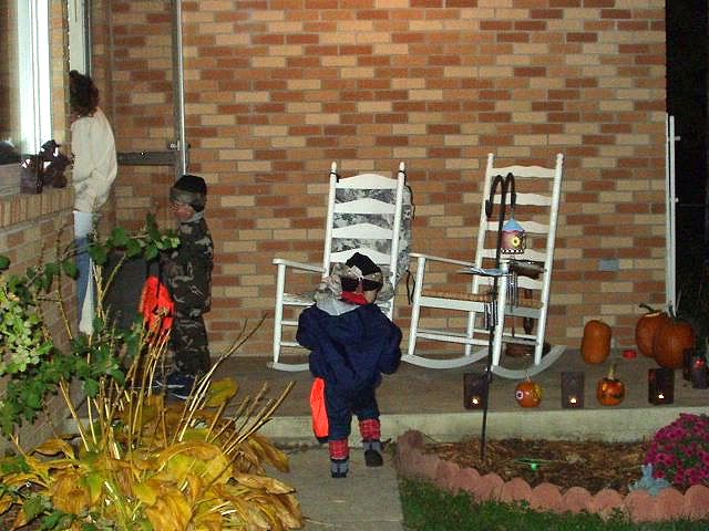 Timothy really blends in with the brick wall :) hehe  Elijah wanted to blow the candles out.
