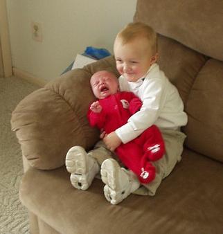 Mary doesn't look to happy at the moment. Elijah really loves his little sister. He calls her 'Mame'.