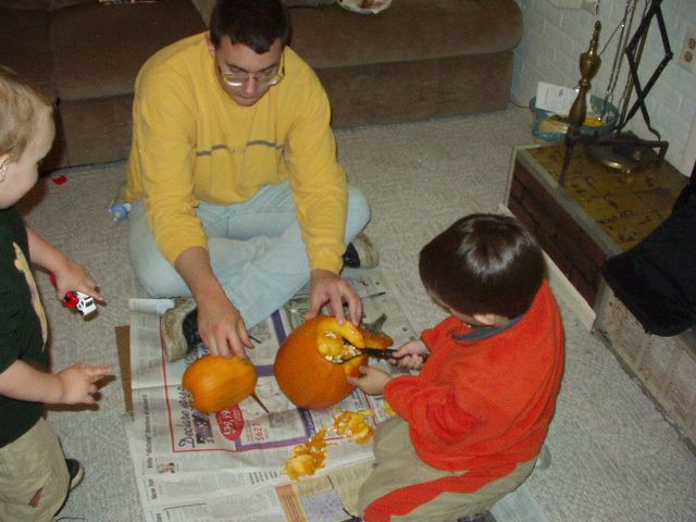 Timothy is helping scoop out the guts.