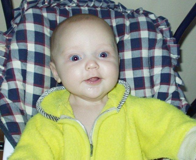 Abigail is wearing Daddy's OLD sleeper :)