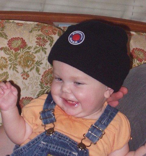 Mary is wearing Timothys hat :) And of course - laughing at Daddy!!!