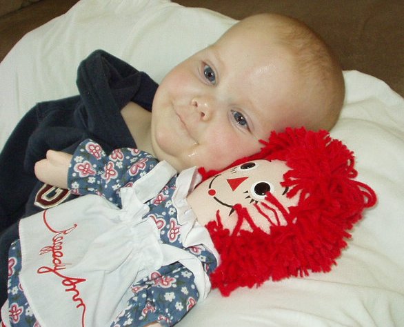Mary is loving on her Raggedy Ann doll from Mamaw!