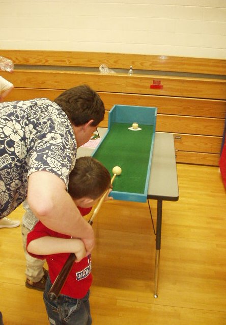 Daddy gave me some pointers on how to hit the ball.