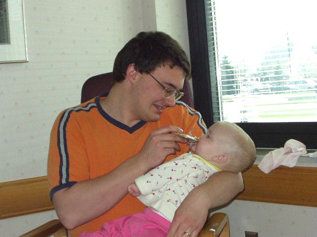 Mary is going to be 30lbs by the time Daddy goes back to work. (that's a cookie she is eating :)