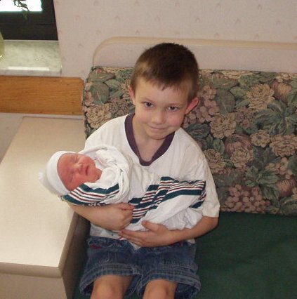 Timothy holding Abigail for the first time!