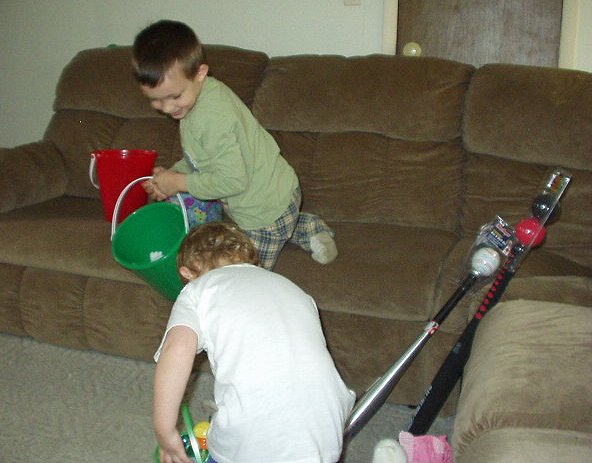 Timothy was on the move collecting eggs...Elijah was having fun looking in his basket.