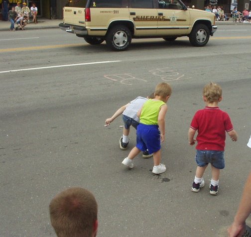 Timothy and Elijah picking up candy.