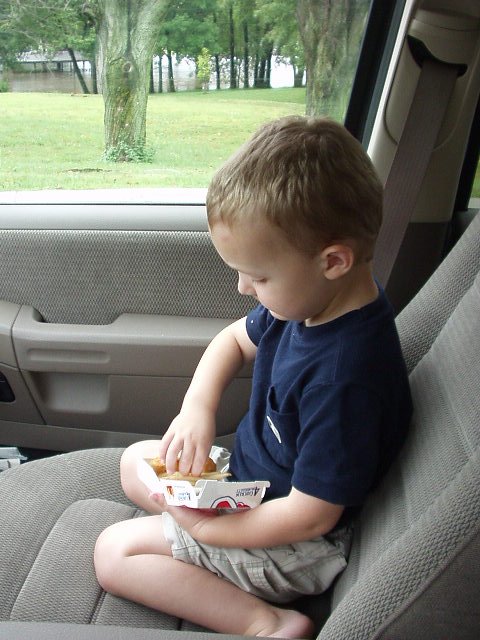 Elijah is eating a happy meal before he goes to school!!