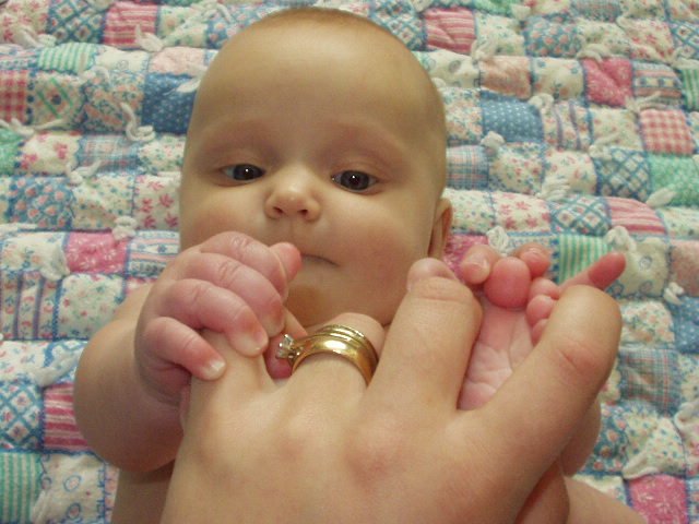 I think I can get mommy if I use both of my hands and my toes!