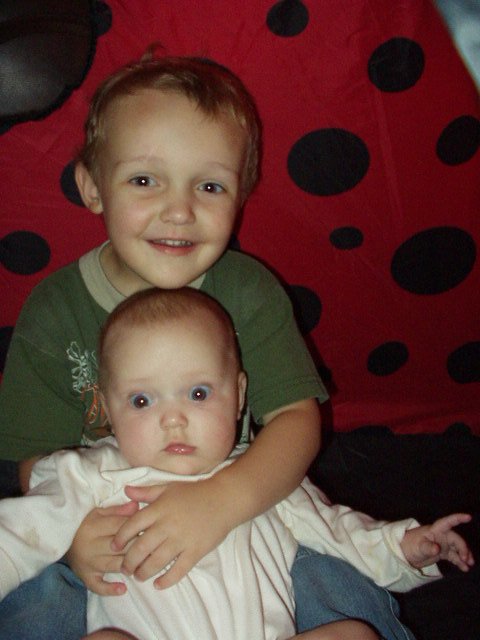 Abigail and Elijah spend some time together in the lady bug tent.
