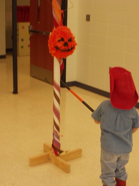 Elijah had to show all of the kids how to hit the piñata! (sorry the pic is blurry)