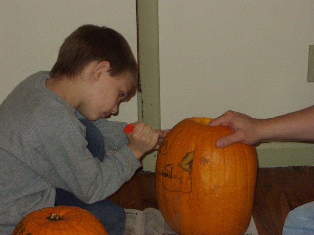Timothy is carving his own pumpkin :)