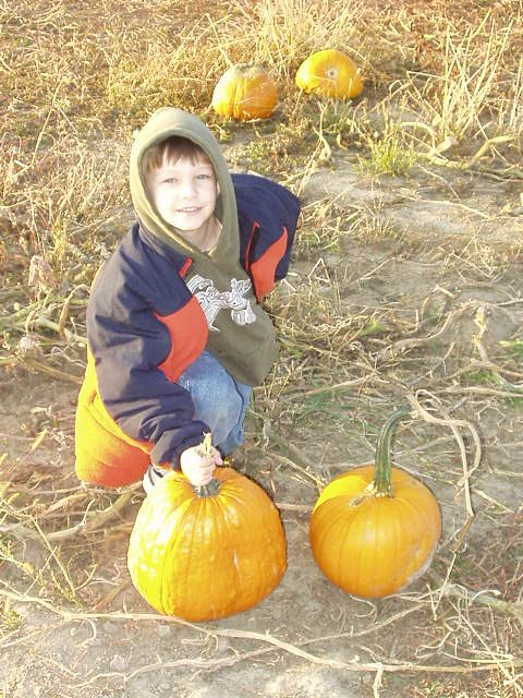 Timothy with his pumpkin that he picked out.