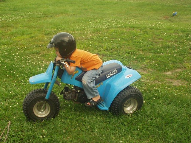 Elijah is hanging out on the 3-wheeler :)