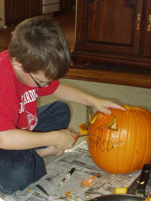 Timothy cleaned out his pumpkin and carved it all by himself :)