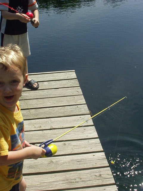 You have to love Elijah's face in this picture! I opened the camera to take a picture of Elijah's fish and as I snapped the fish 'unhooked' itself and flopped into the water (you can see the little splash)!!