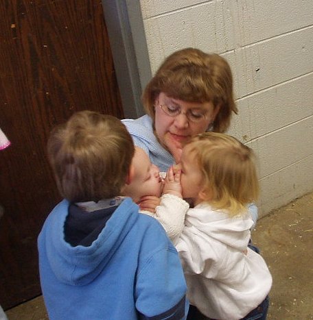 Caitlyn is trying to give Abigail kisses :)