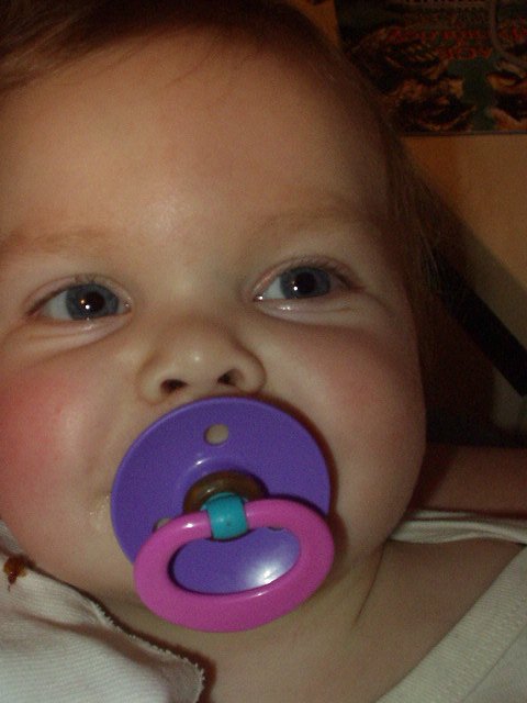 Mary has a smile behind that pacifier :) She is so funny!