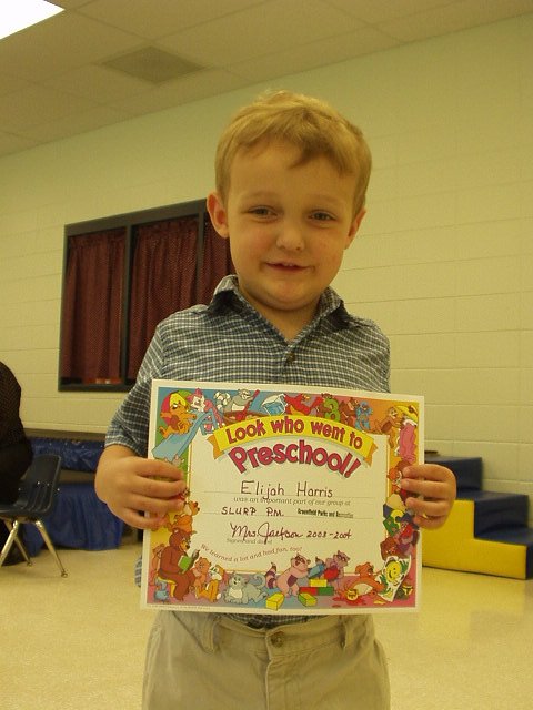 Elijah is holding his certificate! We will have three kids in school next year!!!