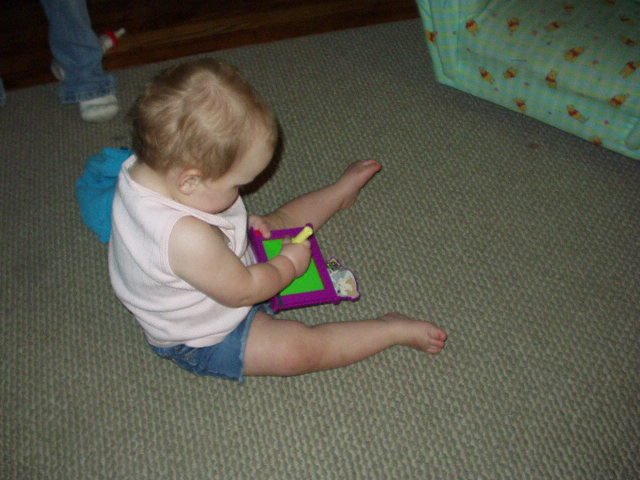 Abigail looks so big drawing with this toy.