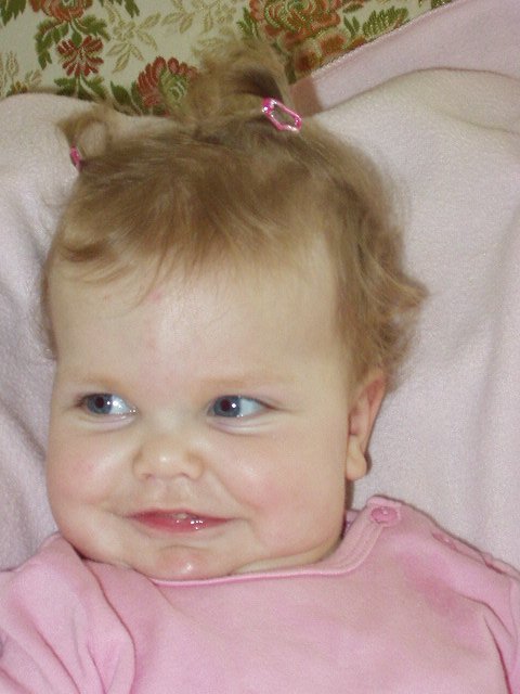 Mamaw put my hair up in my first pig tails!