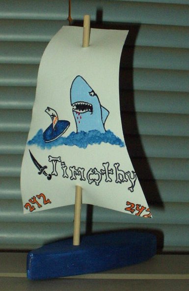 Timothy is ready to race his boat at the Raingutter Regatta!