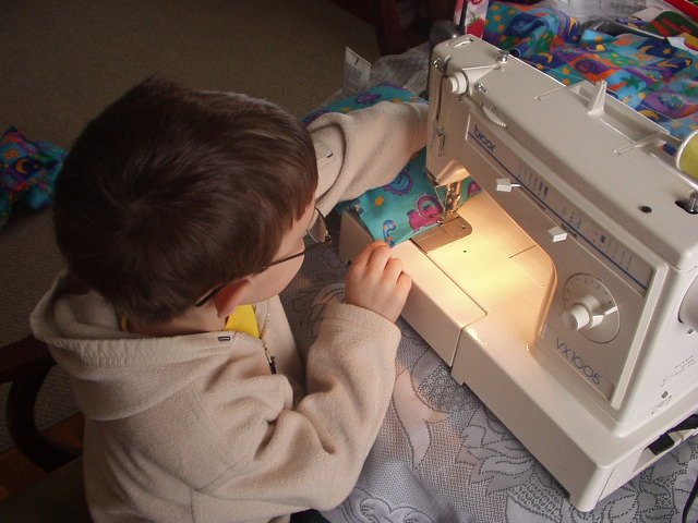 Timothy stuffed the pillows and then helped sew them! Great Grandma and Mamaw would be proud!