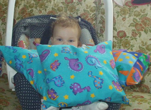 Timothy covered Mary with the pillows that we made together.