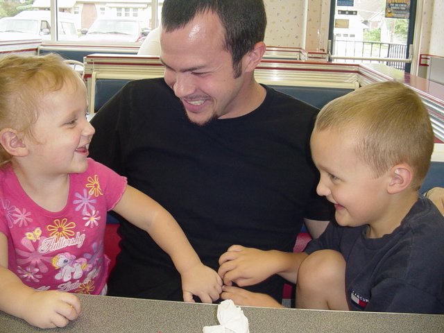 Abigail and Elijah tickle the ice cream out of Kyle!!