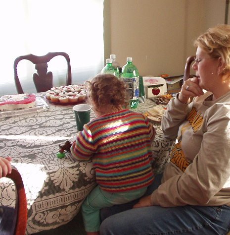 Abigail is sneaking a cupcake with Mamaw!!