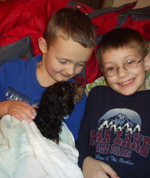 Elijah and Timothy are going to dry the pup.